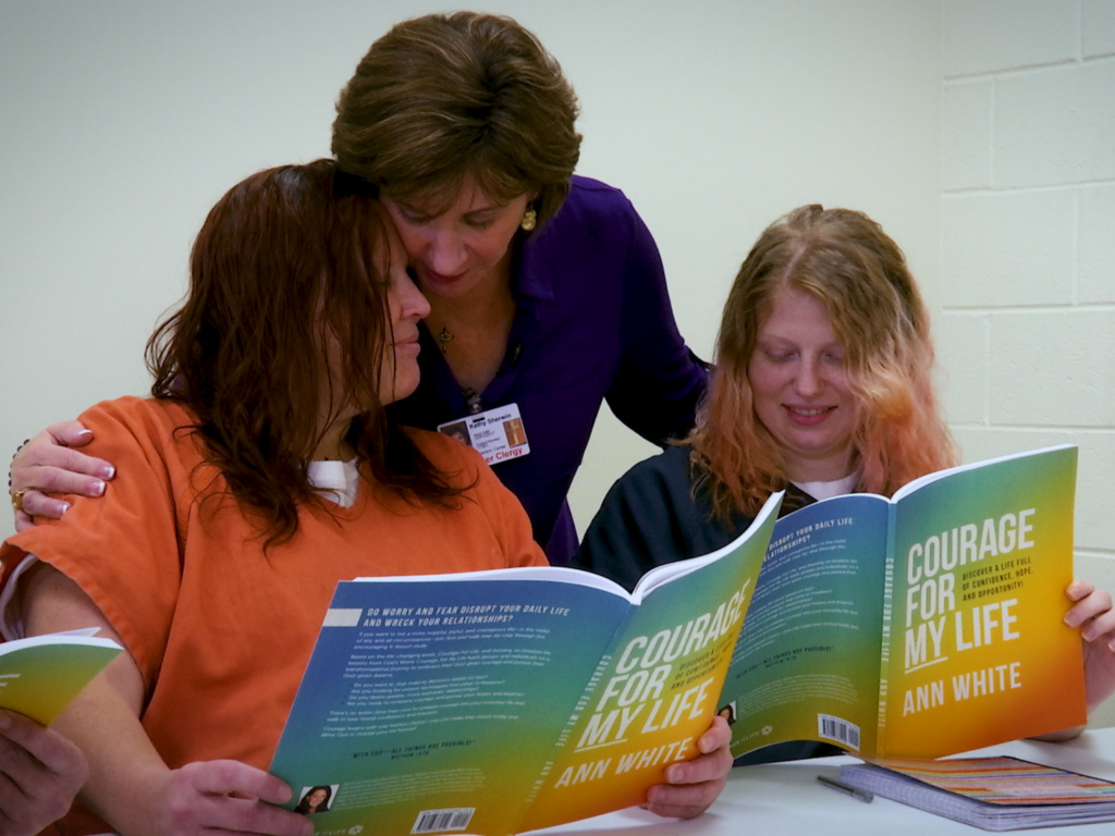 Inmates reading Courage for My Life